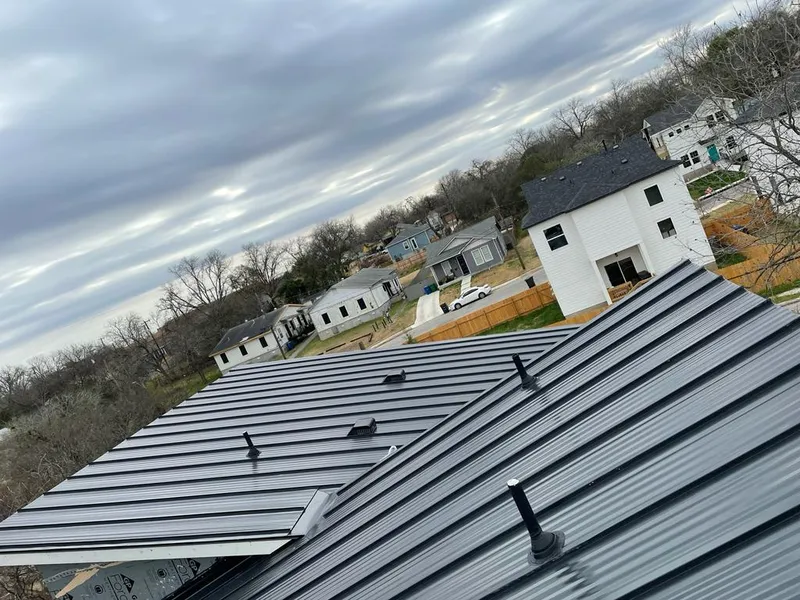 Standing seam metal roof panels with vents for Skylight Repair in Bedford
